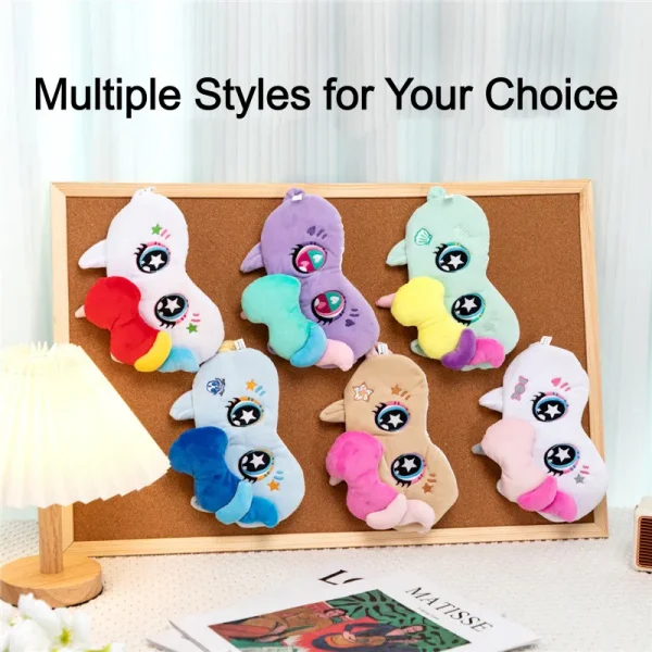 Six styles of cartoon unicorn plush eye masks displayed on a cork board, multiple colors of soft sleep masks to choose from.