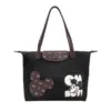 Front view of a black Disney-inspired tote bag with Mickey Mouse patch and monogram flap closure.