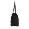 Side profile of a lightweight black nylon handbag with brown straps, showing depth and structure.