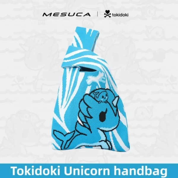 Sky blue MESUCA x Tokidoki knit wristlet bag with woven unicorn pattern and wide wrist strap on a wave background.