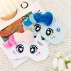 Two plush unicorn sleep masks in blue and white with embroidered star eyes and soft 3D manes, cute eye masks for travel naps.