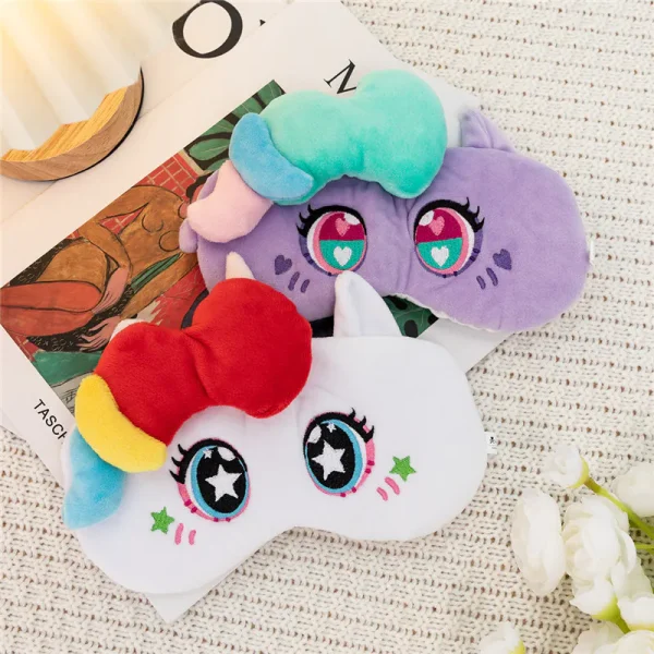 Purple and white plush unicorn eye masks with colorful 3D manes and embroidered star eyes, soft sleep masks for kids.