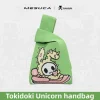 Green Tokidoki knit wristlet bag featuring a cute kawaii dragon character jacquard pattern with wide fabric wrist strap.（