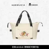 A front view of the official Tokidoki x Mesuca cream-colored foldable travel tote bag featuring a kawaii 'Stay Wild' squirrel unicorn print and black handles.