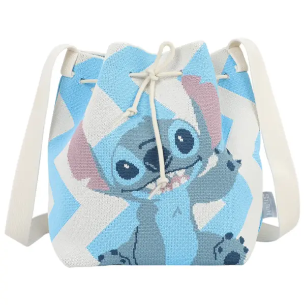 Front view of a blue and white woven bucket bag featuring a large Disney Stitch character design and drawstring closure.