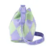 Side view of a purple and green argyle knit bucket bag with a woven "BUZZ" strap and drawstring closure.