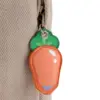 Close-up view of the cute orange carrot-shaped leather zipper pull attached to the side pocket of the Judy Hopps themed rucksack.