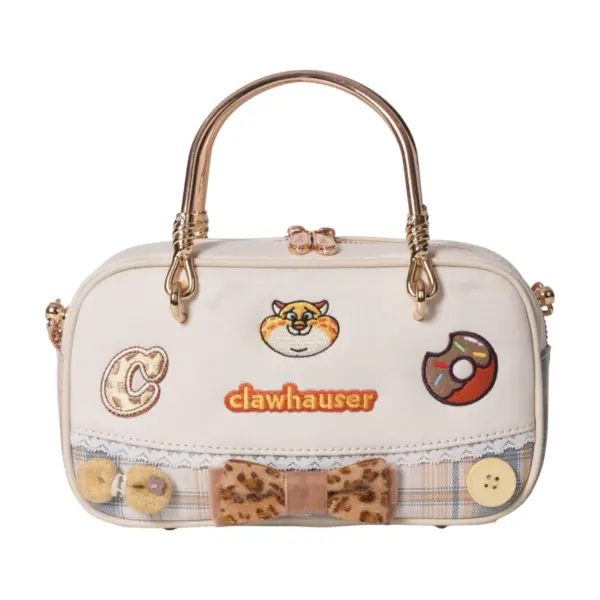 Direct front shot of a pastel cream mini tote bag with embroidered cheetah face, donut patch, lace trim, bow tie, crochet flowers, and "CLAWHAUSER" text.