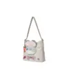 Side profile of the soft grey microfiber hobo bag showing its slouchy shape, adjustable strap, and fluffy bunny ears detail.