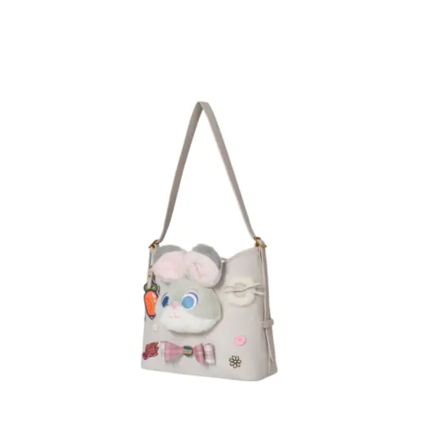 Side profile of the soft grey microfiber hobo bag showing its slouchy shape, adjustable strap, and fluffy bunny ears detail.