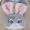 Extreme close-up of the ultra-soft faux fur texture on Judy Hopps' big blue eyes and pink-lined ears, emphasizing the cozy quality of the bag.