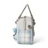 Side profile of the structured doctor bag featuring blue and white plaid patchwork, silver metal handle, and chain strap details.