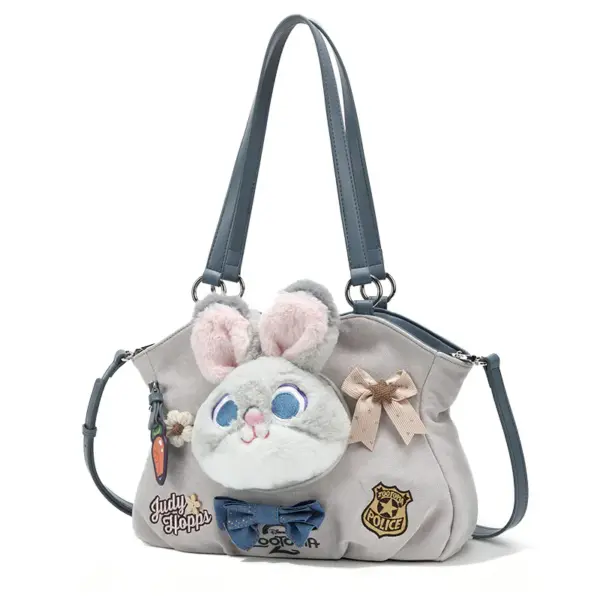 Side angle highlighting the fluffy bunny ears protruding from the top of the grey handbag, along with detailed embroidery patches.