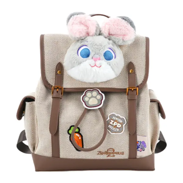Front view of a beige canvas backpack with Judy Hopps plush head, "Junior ZPD Officer" badge, and carrot accessory.