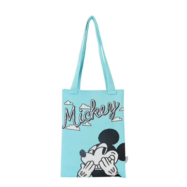 Front view of a turquoise knit tote bag featuring a shy Mickey Mouse graphic and cursive "Mickey" text with clouds.