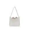 Clean back view of the oatmeal-colored suede handbag with simple drawstring accents at the corners, highlighting its versatile design.