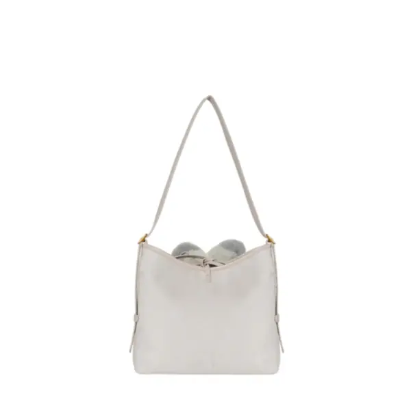 Clean back view of the oatmeal-colored suede handbag with simple drawstring accents at the corners, highlighting its versatile design.