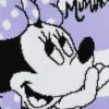 Extreme close-up of the woven Minnie Mouse face and polka dot bow pattern on purple knit fabric.