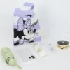 Flat lay showing a purple Minnie Mouse knit pouch next to a phone, umbrella, perfume, and makeup compact.