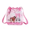Front view of a pink knitted bucket bag featuring cute Nick Wilde and Judy Hopps characters peeking over a donut frosting design.