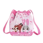 Front view of a pink knitted bucket bag featuring cute Nick Wilde and Judy Hopps characters peeking over a donut frosting design.