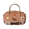 Direct front shot of a tan mini tote bag with embroidered fox face, lace trim, bow tie, crochet flowers, and "NICK WILDE" text.