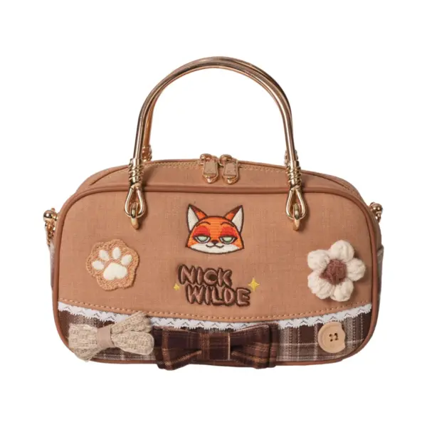 Direct front shot of a tan mini tote bag with embroidered fox face, lace trim, bow tie, crochet flowers, and "NICK WILDE" text.