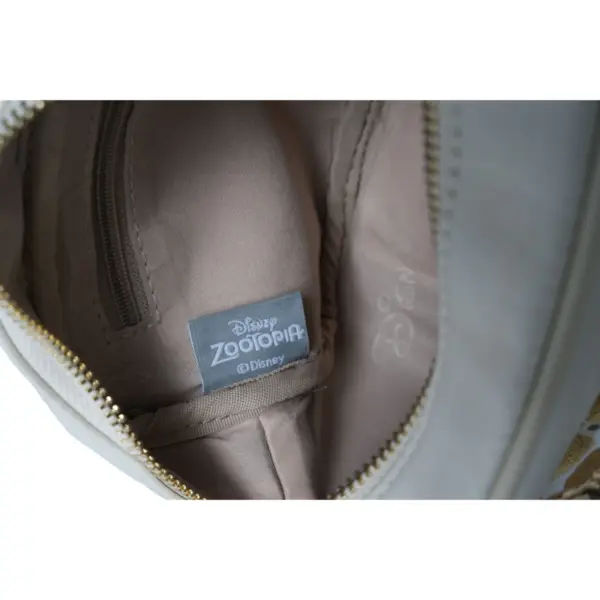 Close-up of the interior lining showing the authentic "Disney ZOOTOPIA ©Disney" woven label tag and branded fabric.