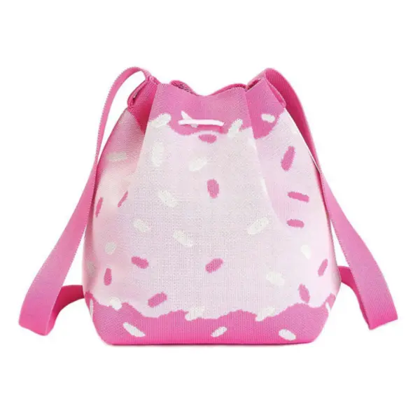 Back view of a pastel pink woven bag with white frosting and sprinkle pattern, featuring a drawstring closure.