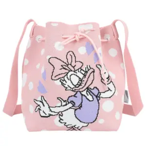 Front view of a pink knit bucket bag with white polka dots and a large Daisy Duck graphic in a purple dress.