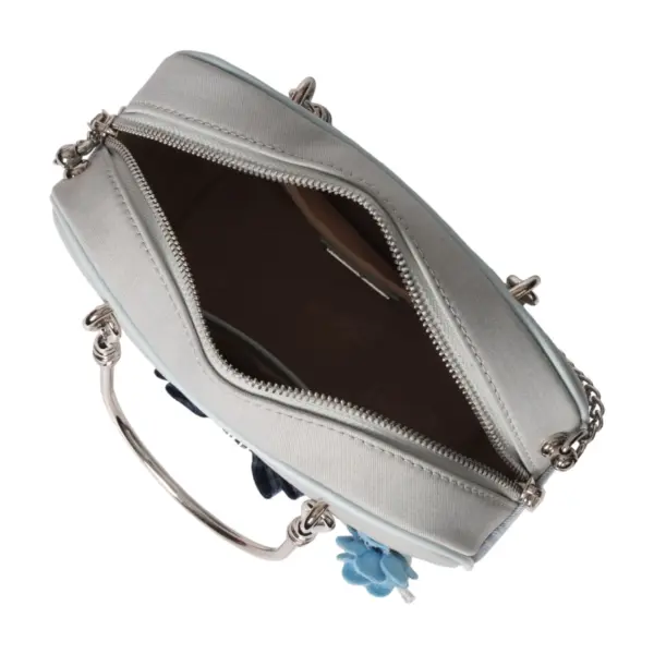 Top-down open view revealing the organized compartments and ample storage space inside the vintage-style carryall.