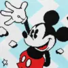 Close-up of the woven Mickey Mouse character with red shorts on a blue zig-zag pattern background.