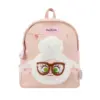 Direct front shot of a light pink herringbone mini backpack featuring a large 3D plush sheep head with curly white wool and black glasses.