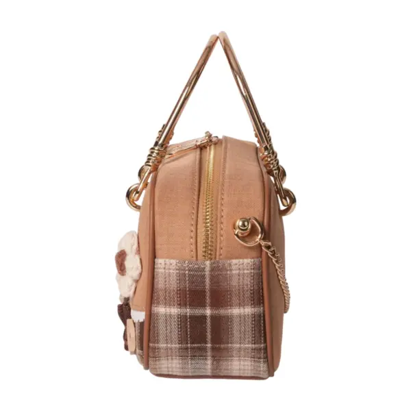 Side profile of a brown canvas doctor bag featuring plaid patchwork, gold metal handle, and chain strap details.